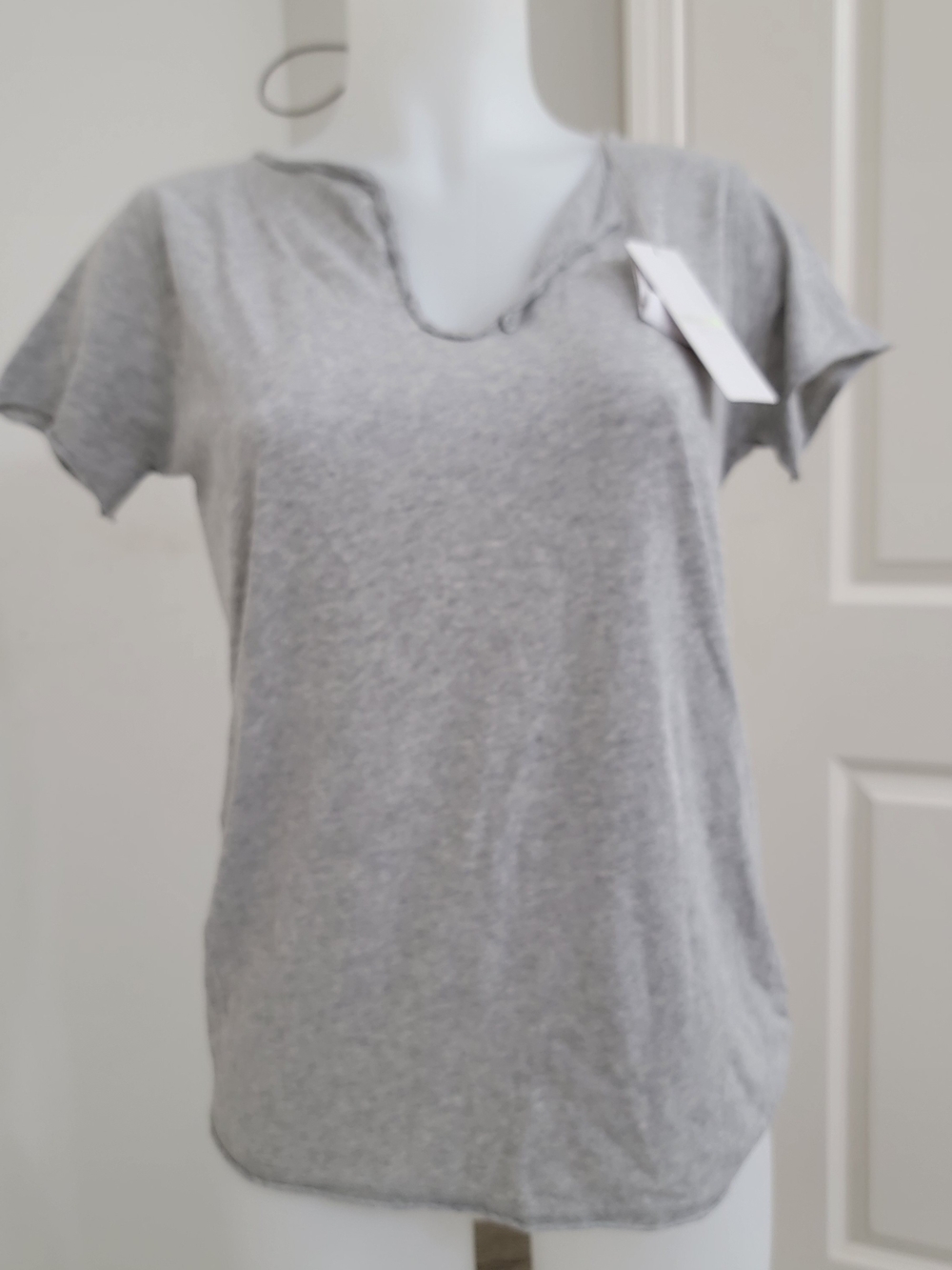 Gray short-sleeve T-shirt with a large rhinestone or beaded skull embellishment